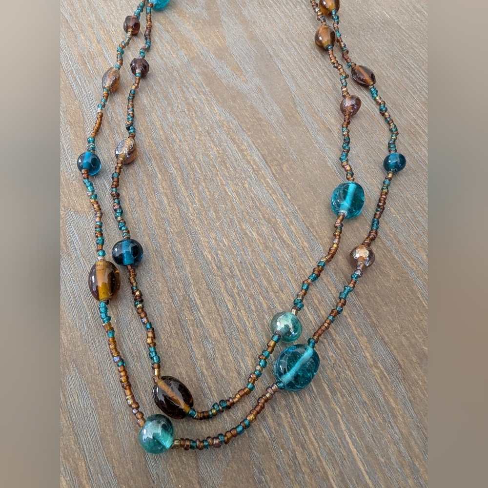 Elegant Beaded Necklace with Blue and Brown Accents